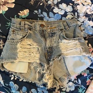 Distressed studded shorts
